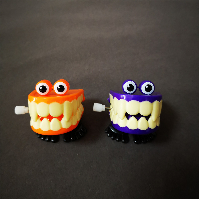 jumping wind up chain canine teeth dancing toys