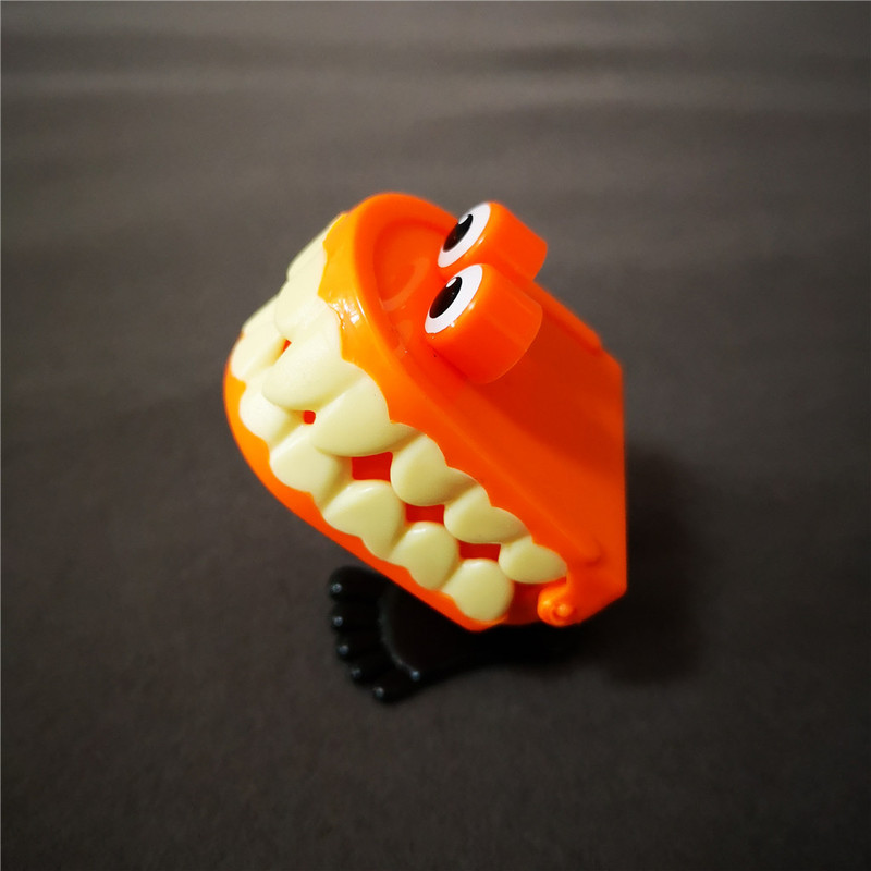 jumping wind up chain canine teeth dancing toys